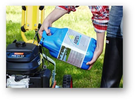 Aspen alkylate fuel being poured into lawn equipment